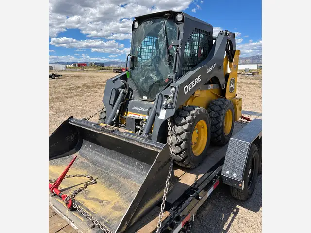 318P with bucket · Trailer rented separately